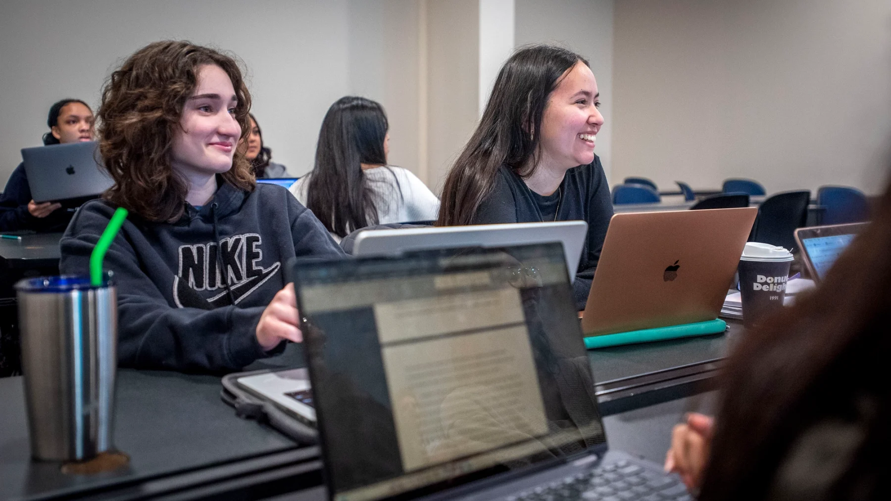 Students in classroom on laptop computers.