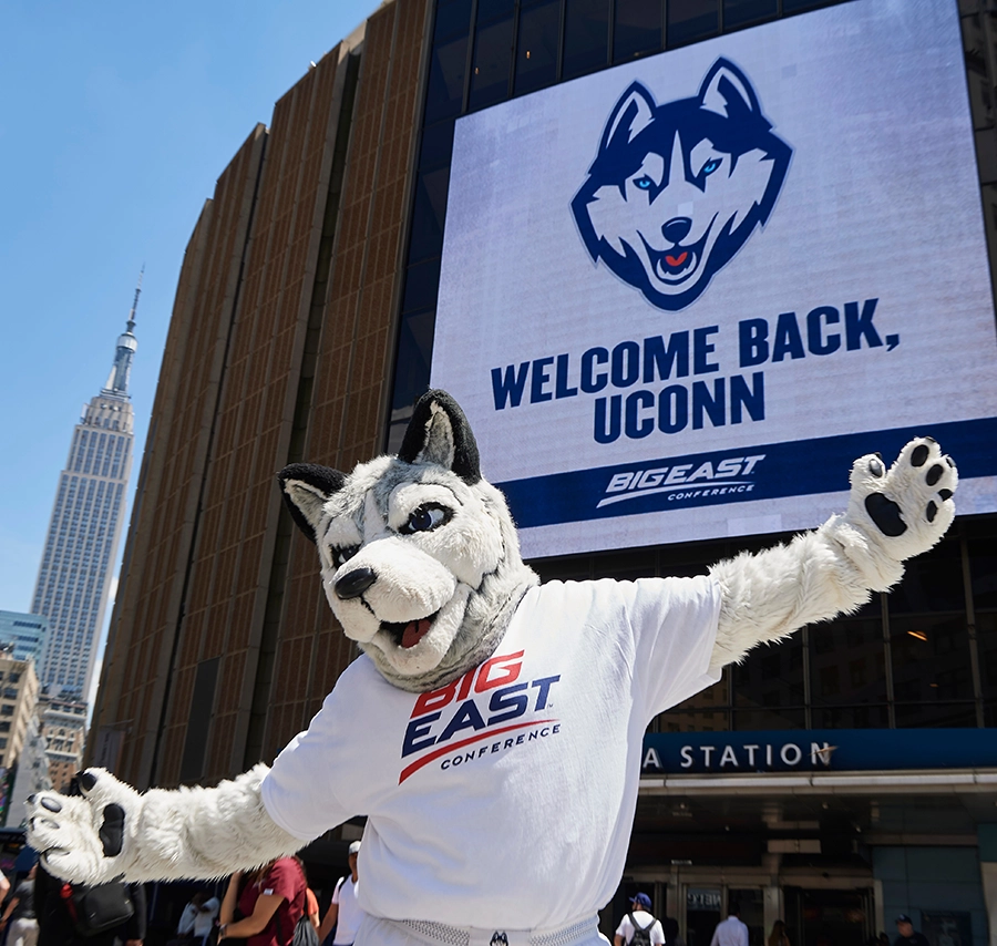 Jonathan the husky mascot in front of Madison Square Garden at the Big East Conference championship.